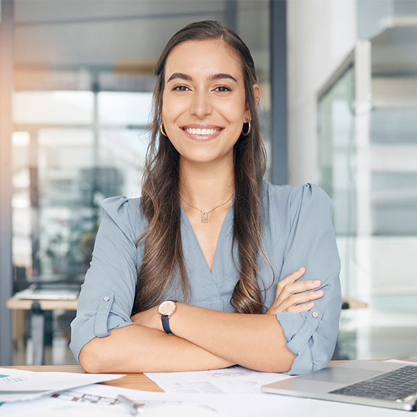 Woman working at her desk.